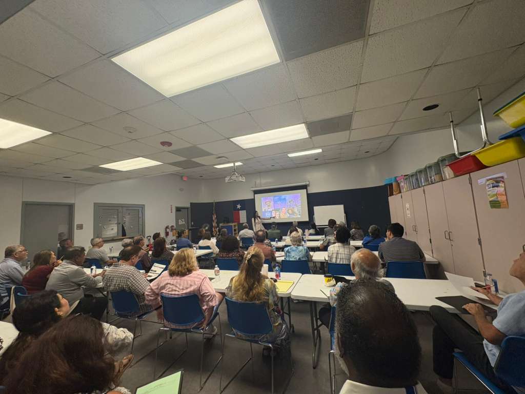 Attendees at an Alpha Lee Insurance educational workshop viewing a presentation on options and flexibility